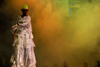 Port of Spain, Trinidad and Tobago: woman on stilts is singing on stage during carnival - photo by E.Petitalot