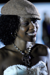 Port of Spain, Trinidad and Tobago: smiling black woman wearing a cap during carnival - photo by E.Petitalot