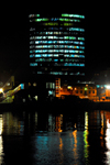 Port of Spain, Trinidad: office tower by the harbour - nocturnal image - photo by E.Petitalot