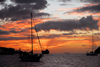 Trinidad: sunset in a Caribbean harbour - sailing boats and tanker - photo by E.Petitalot