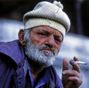 Istanbul, Turkey: old bearded man smoking - street scene - photo by W.Allgwer