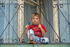 Yusufeli, Artvin Province, Black Sea region, Turkey: boy in a balcony - photo by W.Allgwer