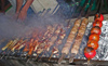 Ashgabat - Turkmenistan - preparing meat and vegetable shashliks - Shish kebabs - mangal grill - photo by G.Karamyanc / Travel-Images.com
