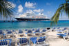 Grand Turk Island, Turks and Caicos: southwestern beach - palms, deckchairs and Holland America cruise ship Prinsendam - photo by D.Smith