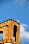 Kampala, Uganda: clock tower detail at Makerere University against blue sky - colonial architecture, former University of East Africa - photo by M.Torres