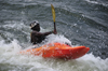 Bujagali Falls, Jinja district, Uganda: kayaker struggles with turbolent water on the falls, a combination of catarats and rapids on the river Nile - seen from the Eastern bank - in 2012 the falls were submerged by the Bujagali Dam - photo by M.Torres
