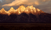 USA - Grand Teton NP (Wyoming): Sun rays hitting the snowy peaks of Grand Teton - sunrise - photo by J.Fekete