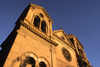 Santa F, New Mexico, USA: Cathedral Basilica of St. Francis of Assisi - built in yellow limestone - designed by the French architect Antoine Mouly - start of East San Francisco Street - photo by C.Lovell