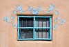 Ranchos de Taos, Taos County, New Mexico, USA: window framed with painted flowers on an adobe wall - St. Francis Plaza - photo by M.Torres