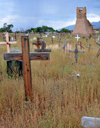 Pueblo de Taos, New Mexico, USA: tall grass in the unkept cemetery around the ruins of the old Spanish Franciscan Church of San Geronimo - photo by M.Torres