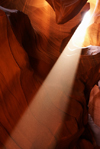 Antelope Canyon, Navajo Nation, Arizona, USA: beam of sunlight radiating down from openings in the top of the canyon - photo by A.Ferrari