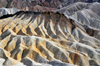 Death Valley National Park, California, USA: Zabriskie Point - badlands - water erosion produces bone-dry, finely-sculpted, golden brown rock - Furnace Creek Formation - alluvial fan - photo by M.Torres