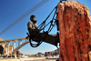 Hoover Dam, Clark County, Nevada, USA: Hoover Dam High Scaler Joe Kine statue, sculptor Steven Liguori - Mike O'Callaghan  Pat Tillman Memorial Bridge in the background - photo by M.Torres