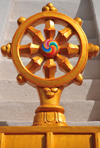 El Rito, New Mexico, USA: Kagu Mila Guru Stupa - Dharmachakra - Wheel of Dharma or Wheel of Law, representes dharma, the Buddha's teaching of the path to enlightenment - chariot wheel with eight spokes - photo by M.Torres