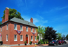 Portsmouth, New Hampshire, USA: red brick residence, cornet of Chapel Street and State Street - patriotic decorations - stars and stripes fans - New England - photo by M.Torres