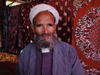 Uzbekistan - Samarkand / Samarqand / Samarcanda / SKD : traditional clothes - Uzbetk man at the bazaar (photo by Alejandro Slobodianik)