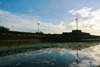 Hue - vietnam: flag tower reflected on the Perfume River - Song Huong - photo by Tran Thai