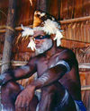 West Paupua - Syuru village - near Agats, Asmat region: Asmat man with feathered hat - photo by G.Frysinger