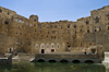 Hababah, Sana'a governorate, Yemen: the town's old cistern is still used - pool and neighbouring stone houses - photo by J.Pemberton