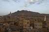 Sana'a / Sanaa, Yemen: view over the Old City to the mountains - ancient skyscrapers - UNESCO World Heritage Site - photo by J.Pemberton