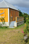 The Valley, Anguilla: orange cottage with zinc roof - Carribbean dwelling, Anguillean charm - photo by M.Torres