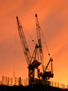Australia - Melbourne (Victoria): docklands - cranes at sunset - photo by Luca Dal Bo