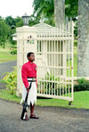 Suva, Viti Levu island, Fiji - Central Division: Guard on duty outside the Parliament building - soldier in a skirt - photo by R.Eime