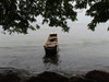 Gabon - Cap Estrias - Estuaire province: boat by the shore and the forest - photo by B.Cloutier