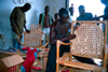 Grand Bassa County, Liberia, West Africa: Buchanan - artisan making a bamboo chair - workshop scene - photo by M.Sturges