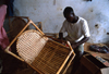 Grand Bassa County, Liberia, West Africa: Buchanan - artisan making a bamboo chair - photo by M.Sturges