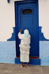 Asilah / Arzila, Morocco - woman and blue door - Medina - photo by Sandia