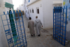 Asilah / Arzila, Morocco - men walking streets of Medina - photo by Sandia