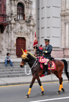 Lima, Peru: mounted officer leads the change of the guard cortge - Plaza de Armas, in front of the Archbishop's palace - photo by M.Torres