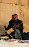 Palmyra / Tadmor, Homs governorate, Syria:playing a Bedouin Rabab, a spike fiddle with quadrilateral sound box covered with skin and a single horsehair string - played with a horsehair bow - photo by M.Torres / Travel-Images.com