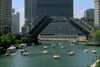 Chicago, Illinois, USA: a regatta of sail boats on the Chicago River pass under the Michigan Avenue bascule bridge - Double-leaf, double-deck, fixed counterweight, trunnion bascule - Edward H. Bennet architect - photo by C.Lovell