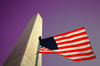 Washington D.C.: Washington monument - flag and purple sky - Photo by G.Friedman