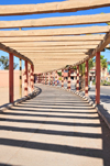 Layoune / El Aaiun, Saguia el-Hamra, Western Sahara: probably the longest pergola in the world - beams and shadows - Place Oum Saad - photo by M.Torres